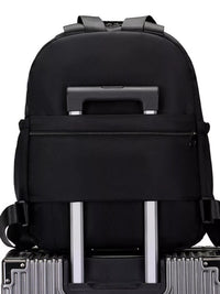 Black backpack with silver handles and wheels on a white background