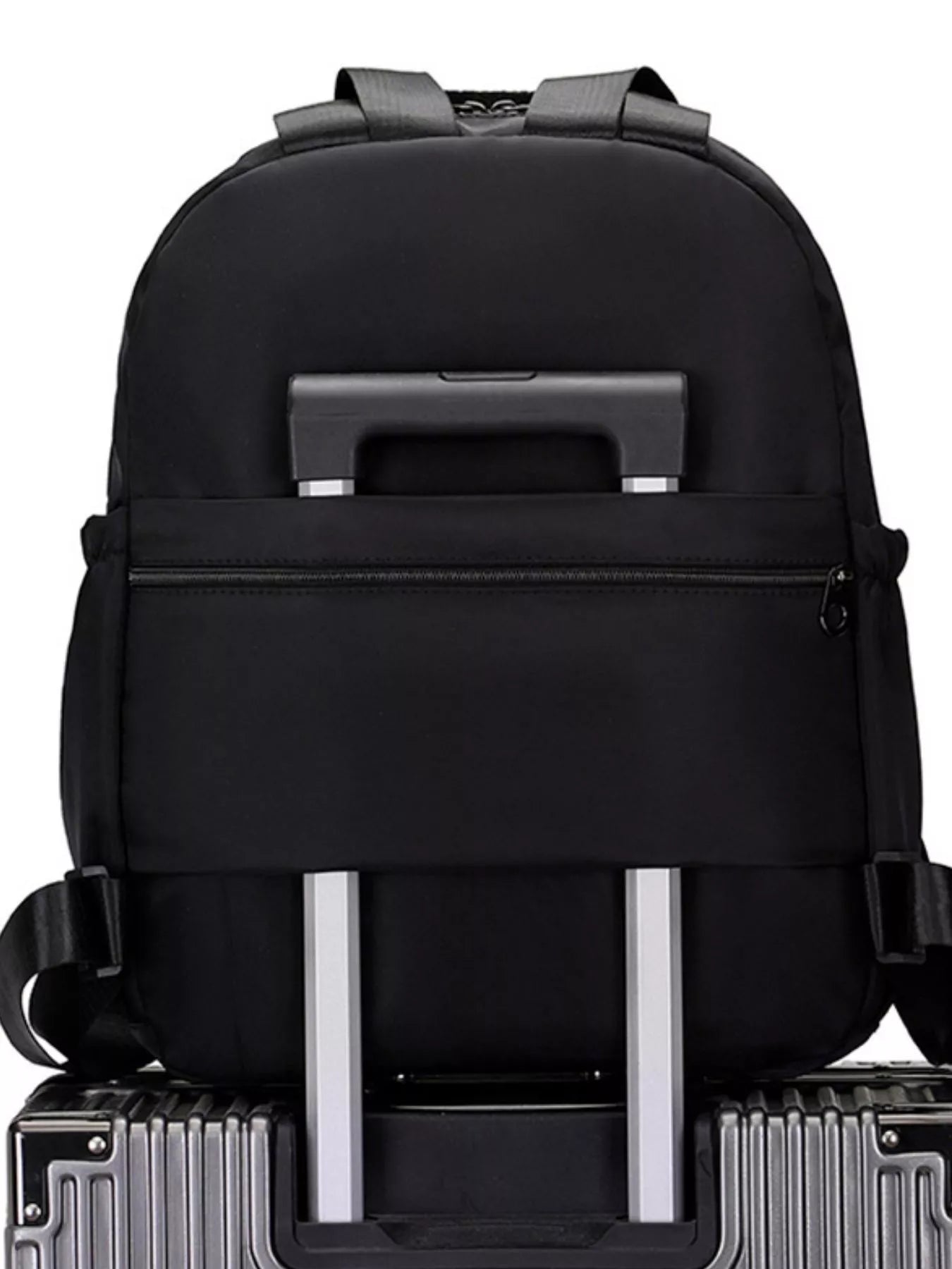 Black backpack with silver handles and wheels on a white background