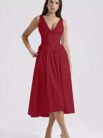Red dress worn by a model on a white background