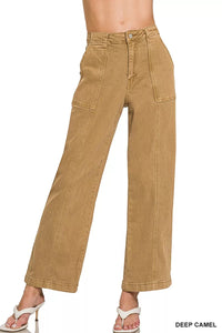 Tan pants on a white background with 'Deep Camel' text at the bottom.
