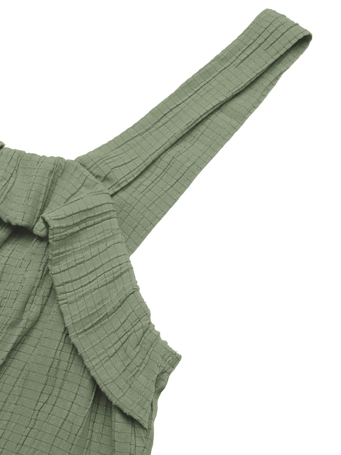 Green textured fabric with a strap on a white background