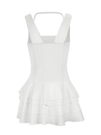 White dress with ruffled layers on a white background