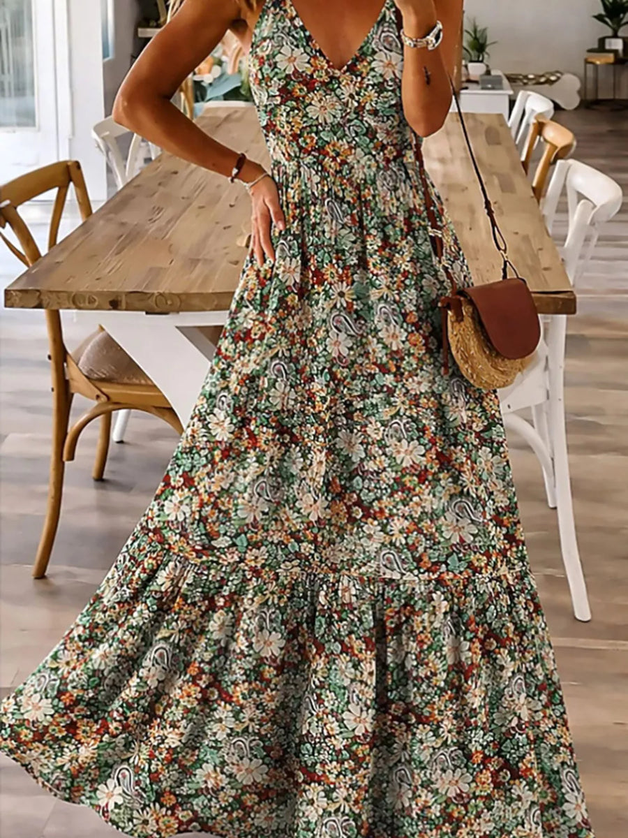 Woman in a floral dress standing in a dining room.