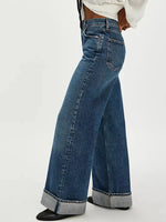 Wide-leg jeans worn by a person on a white background