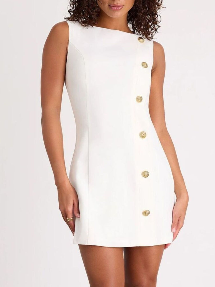 White dress with gold buttons worn by a model on a white background
