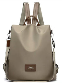 Beige backpack with brown accents on a white background
