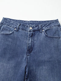 Close-up of blue jeans on a white background
