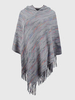 Gray poncho with multicolor stripes and fringes on a white background