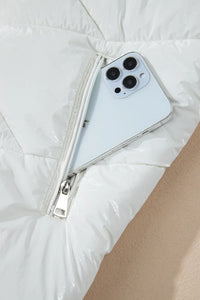 Phone case with a zipper on a white surface