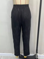 Black cropped pants with a subtle vertical white dash pattern, displayed on a dress form mannequin.