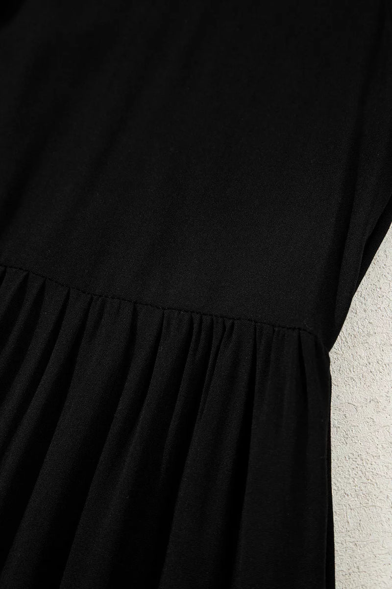 Black dress with a textured surface against a light background