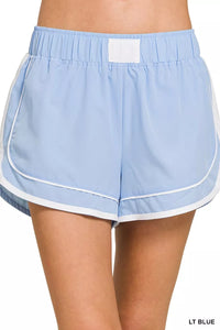 Light blue shorts with white trim on a white background