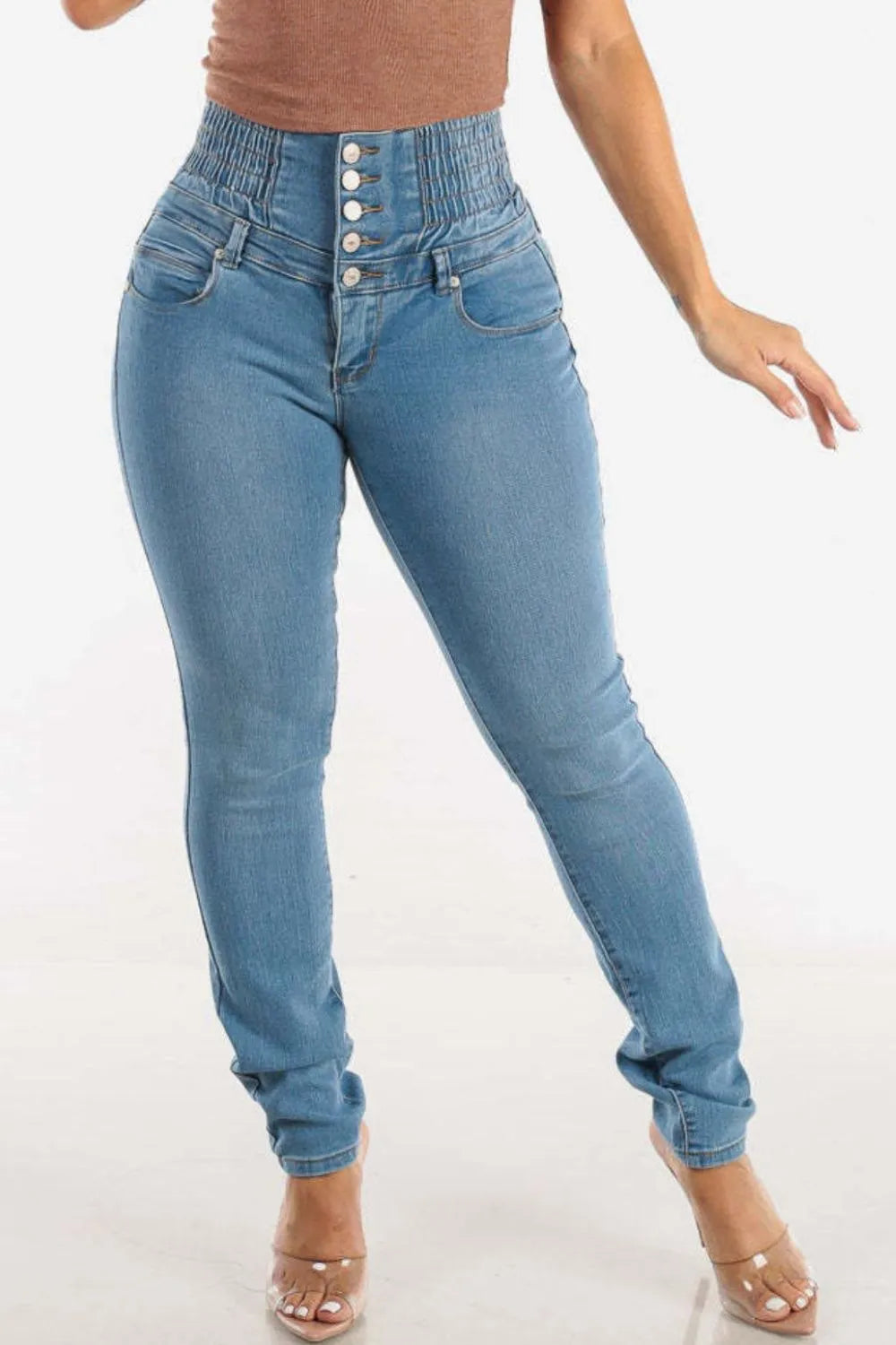 Blue jeans worn by a person on a white background