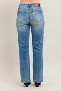 Blue jeans on a plain background