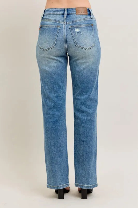 Blue jeans on a plain background