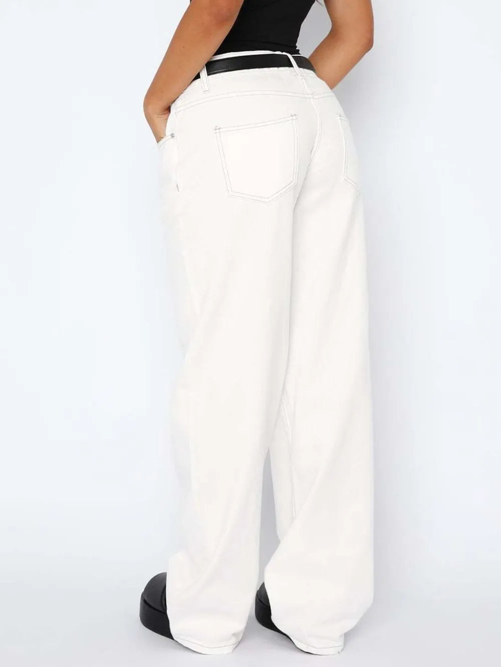 White wide-leg pants worn by a person on a white background