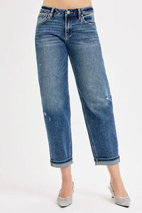Blue jeans worn by a person on a white background