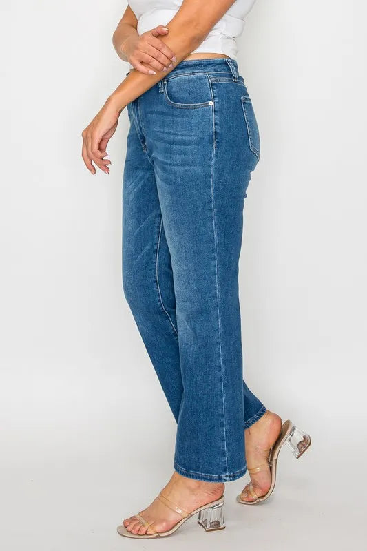 Person wearing blue jeans on a white background