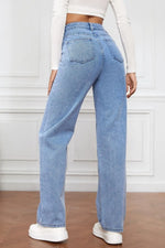 Light blue jeans worn by a person on a white background