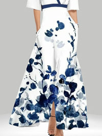 White dress with blue floral pattern on a gray background