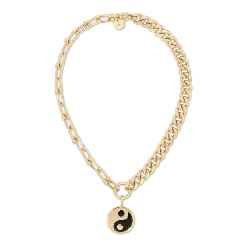 A gold-colored dual chain necklace with a black enamel Yin Yang pendant.