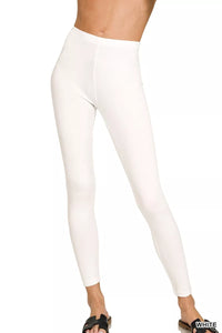 White leggings worn by a person on a white background