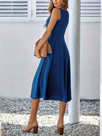 Woman wearing a blue dress with a white background
