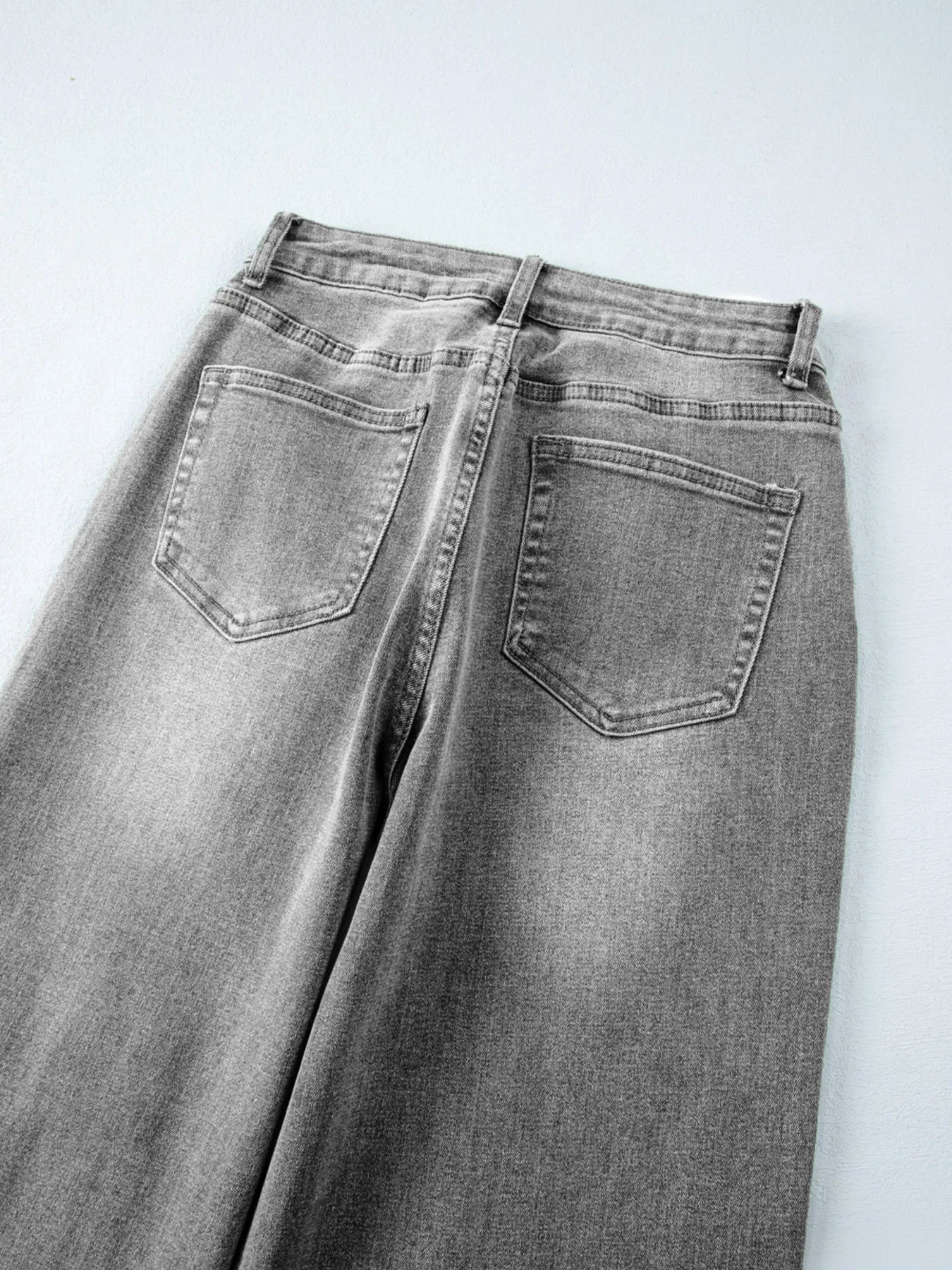 Gray jeans on a white background