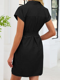 Black dress worn by a person with a white background