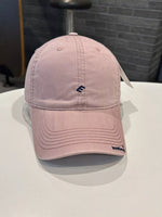 Pink baseball cap with a logo on a white surface