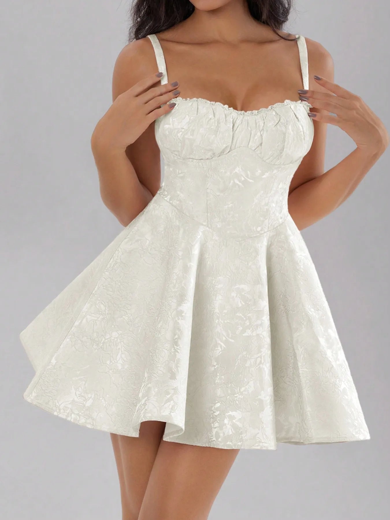 White lace dress on a gray background