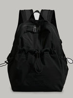 Black backpack on a light gray background