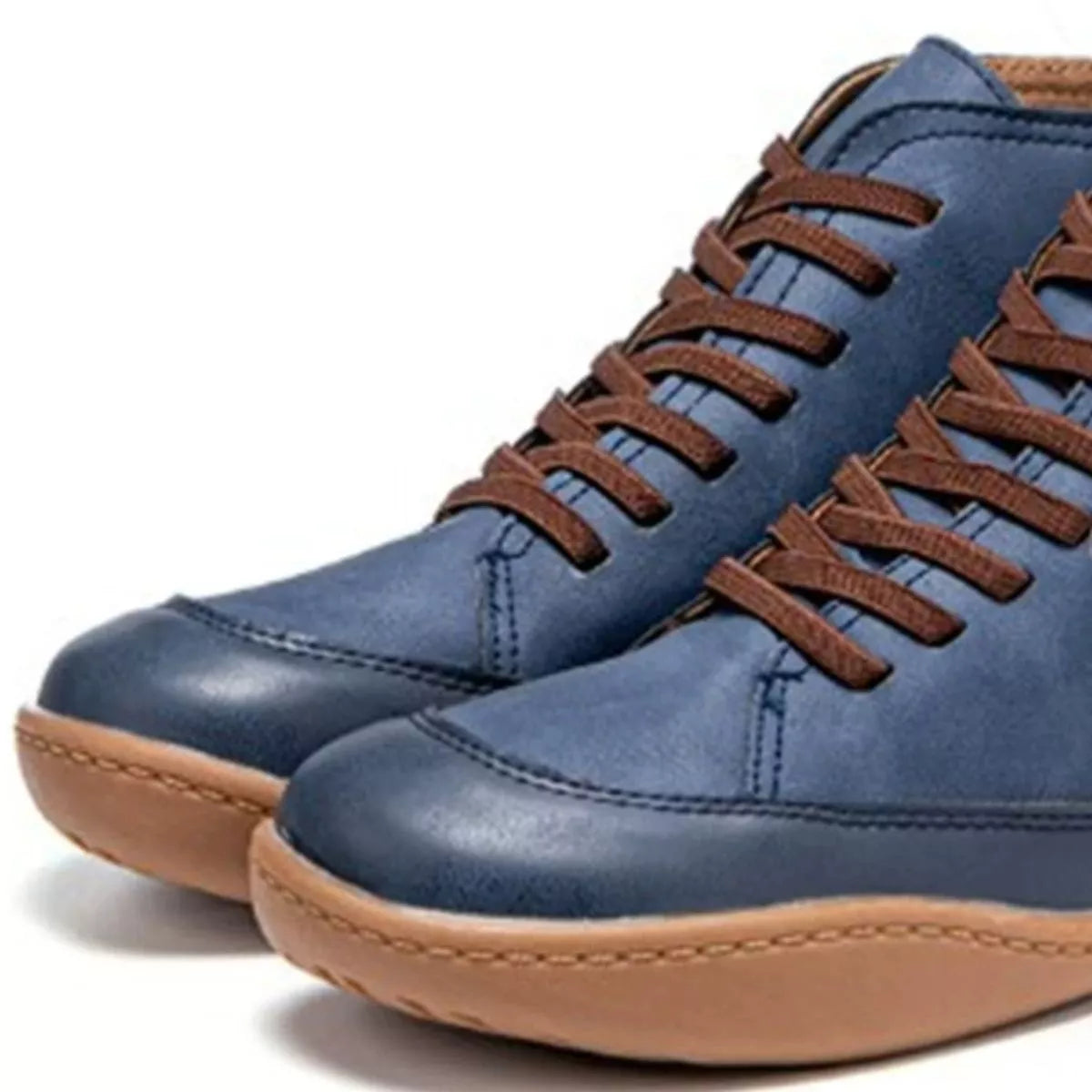 Blue sneakers with brown laces and soles on a white background