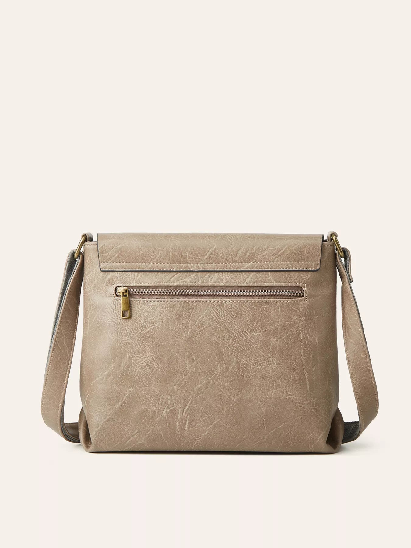 Beige crossbody bag on a light beige background