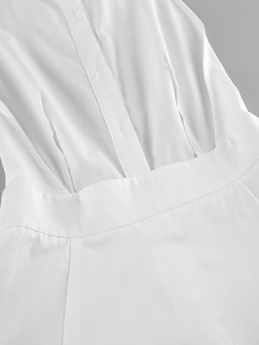 Close-up of a white garment with a focus on texture and folds.