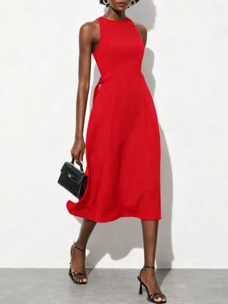Red sleeveless dress worn by a model on a white background