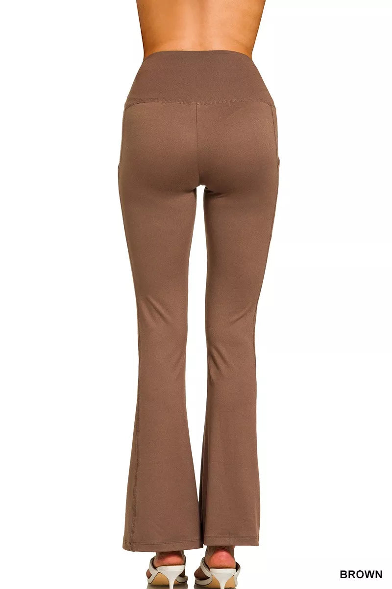 Brown flared pants on a white background