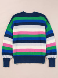 Colorful striped sweater on a beige background