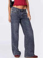 Person wearing blue jeans on a white background