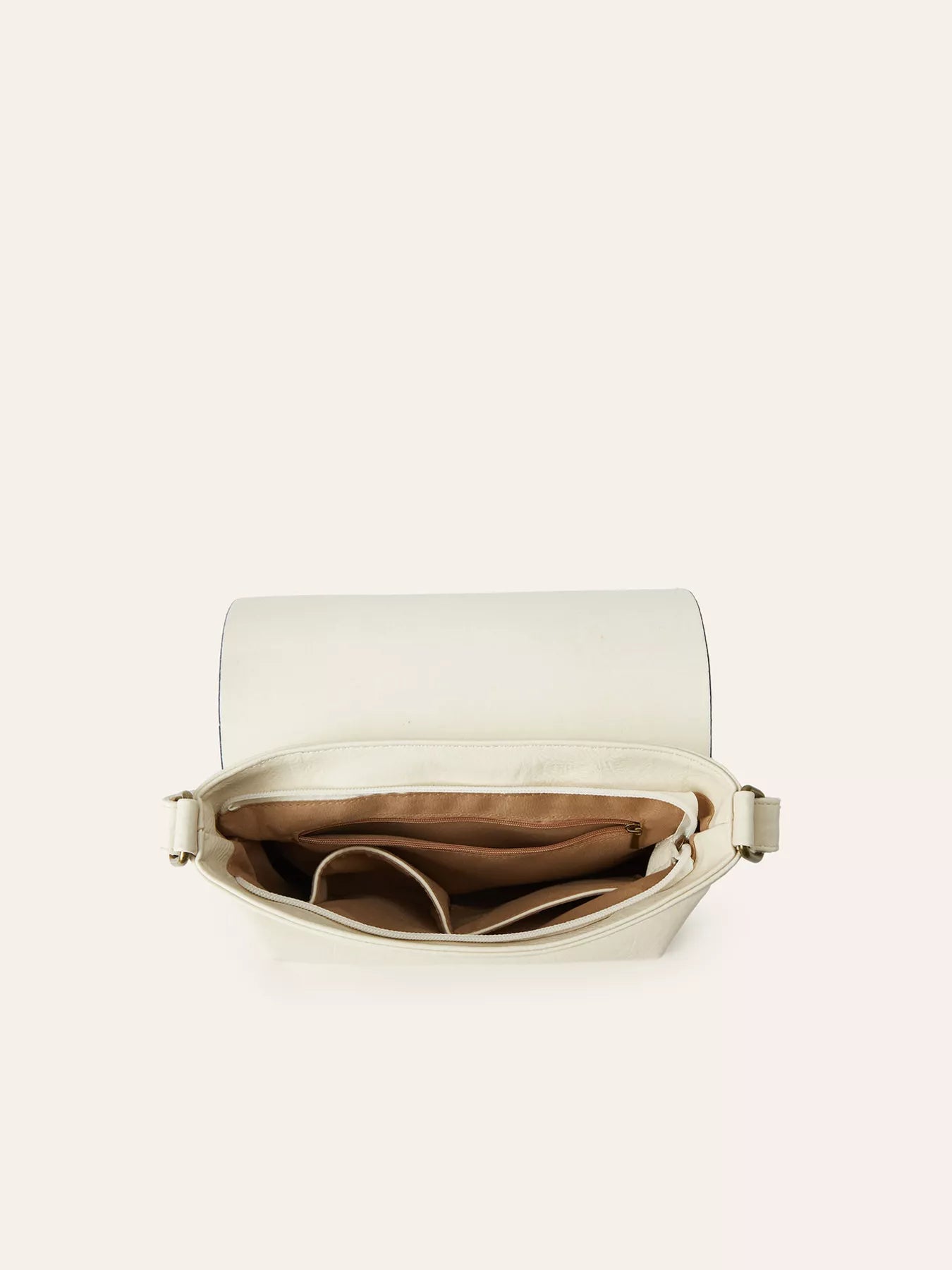 Beige handbag with open flap on a light beige background