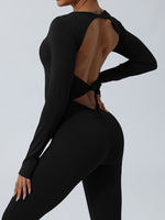 Side view of black Twisted Backless Long Sleeve Jumpsuit