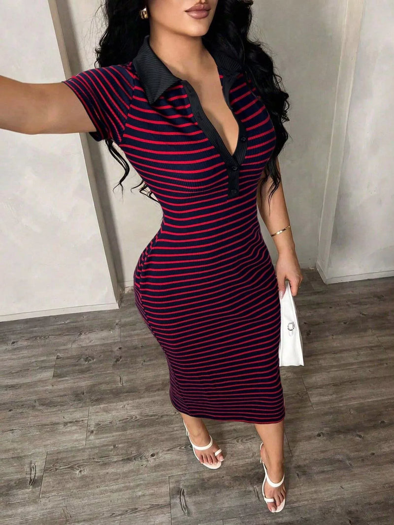 Woman wearing a red and black striped dress with a collar in an indoor setting.