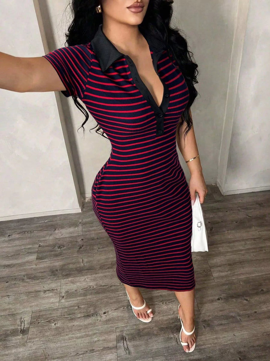 Woman wearing a red and black striped dress with a collar in an indoor setting.