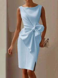 Light blue dress with a large bow detail on a plain background
