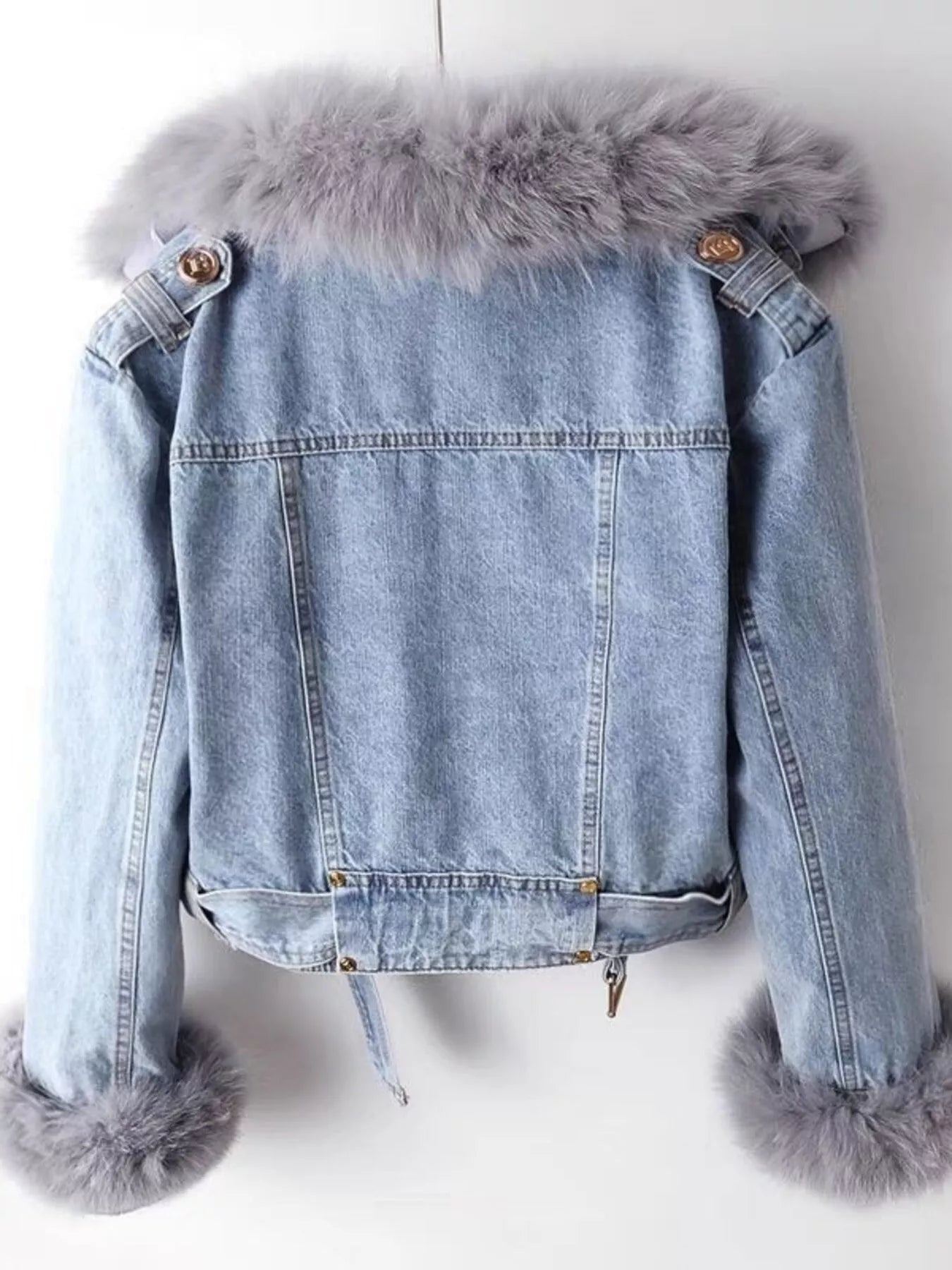 Denim jacket with fur trim on a white background