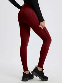 Maroon leggings worn by a person on a white background