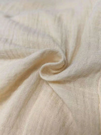 Close-up of beige fabric with a soft texture