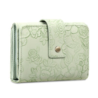 Light green wallet with floral embossing on a white background