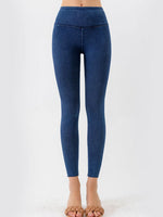 Blue leggings worn by a person on a white background