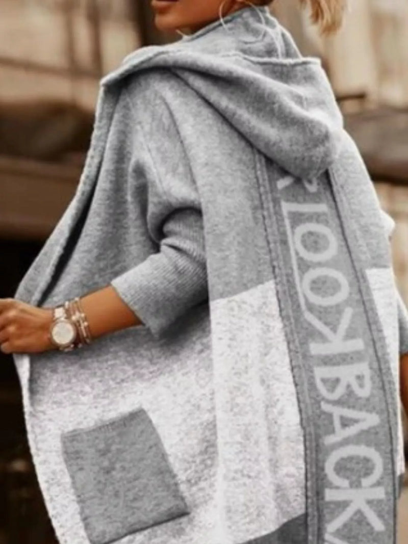 Gray poncho with 'Lookbook' branding worn by a person